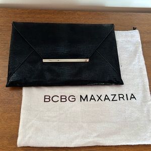 BCBG envelope clutch.  Like new condition.   Slim and stylish, closet staple.